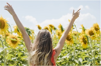 Girl in a field of sunflowers